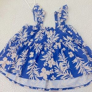 gently used blue beach pattern shirt